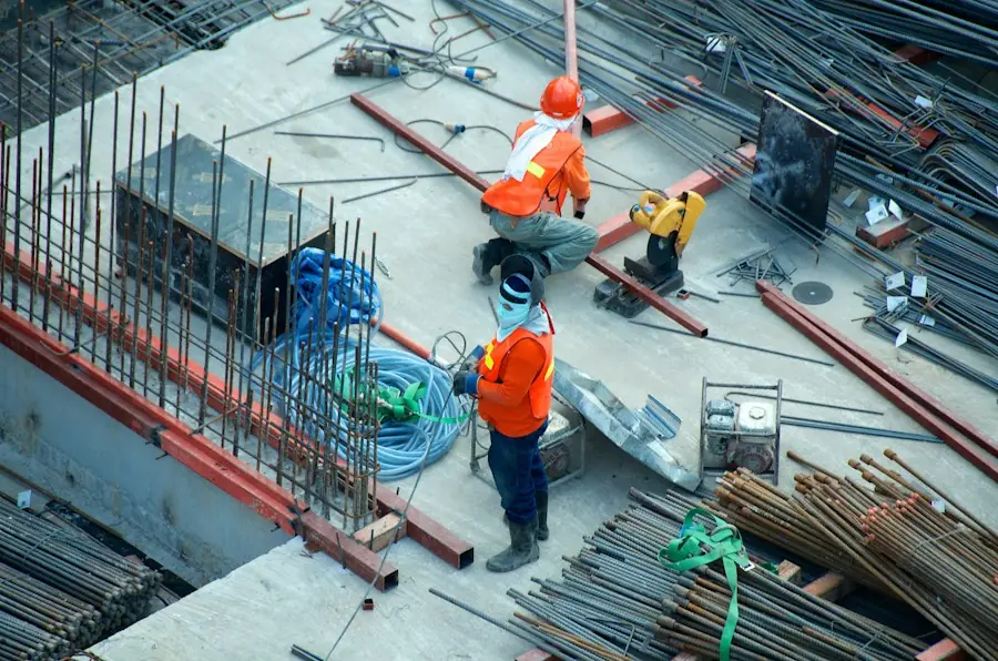 Electricians in hard hats on a large construction deck